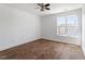 Bedroom features hardwood floors, a large window, and white walls at 509 Spruce Meadows Ln, Willow Springs, NC 27592