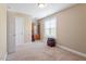 Neutral bedroom features carpet floors, a closet, and ample space at 509 Spruce Meadows Ln, Willow Springs, NC 27592