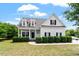 Charming two-story home featuring white siding, black shutters, and a welcoming front porch at 509 Spruce Meadows Ln, Willow Springs, NC 27592