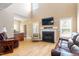Inviting living room with soaring ceilings, fireplace, and hardwood floors at 509 Spruce Meadows Ln, Willow Springs, NC 27592
