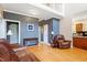 Inviting living room features hardwood floors, neutral paint, and comfortable leather seating at 509 Spruce Meadows Ln, Willow Springs, NC 27592