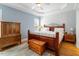 Charming main bedroom with a tray ceiling, wooden accents, and plenty of natural light at 509 Spruce Meadows Ln, Willow Springs, NC 27592