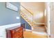 Classic stairway with hardwood floors and a white banister adds elegance to the home at 509 Spruce Meadows Ln, Willow Springs, NC 27592
