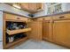 Close up of kitchen cabinetry featuring pull-out pot and pan storage for convenience at 560 Parker Creek Rd, Holly Springs, NC 27540