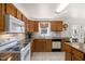 Well-maintained kitchen with oak cabinets, granite counters, and white subway tile backsplash at 560 Parker Creek Rd, Holly Springs, NC 27540