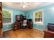 Bright office space with hardwood floors, desk, and windows for natural light at 560 Parker Creek Rd, Holly Springs, NC 27540