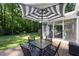 Outdoor patio with seating area and umbrella, perfect for enjoying the backyard at 560 Parker Creek Rd, Holly Springs, NC 27540