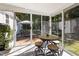 Bright sunroom with tile floors and an outdoor view at 560 Parker Creek Rd, Holly Springs, NC 27540