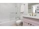 Bathroom featuring a shower-tub combo, toilet, sink with vanity, and modern fixtures at 601 W Rosemary St # 715, Chapel Hill, NC 27516