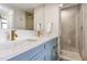 Bathroom featuring a double vanity with modern sinks, sleek fixtures, and a glass-enclosed shower at 601 W Rosemary St # 715, Chapel Hill, NC 27516