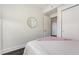 Simple bedroom featuring a minimalist decor, a comfortable bed, and ample closet space at 601 W Rosemary St # 715, Chapel Hill, NC 27516
