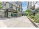 A sophisticated building with retail space, lush greenery, and inviting glass-enclosed entrances at 601 W Rosemary St # 715, Chapel Hill, NC 27516