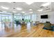 Bright lounge area with hardwood floors, plenty of seating, and expansive windows with views at 601 W Rosemary St # 715, Chapel Hill, NC 27516