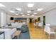 Spacious lounge area with modern furniture, hardwood floors, and ample natural light at 601 W Rosemary St # 715, Chapel Hill, NC 27516