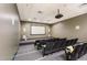 Modern theater room with tiered seating, large screen, and overhead projector for movie nights at 601 W Rosemary St # 715, Chapel Hill, NC 27516
