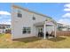 Spacious backyard view shows patio, lawn, and home's exterior at 637 Marrian Dr, Clayton, NC 27520