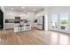 Modern kitchen with stainless steel appliances, white cabinets, and breakfast bar at 637 Marrian Dr, Clayton, NC 27520