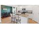 Contemporary kitchen with white cabinetry, granite counters, and breakfast bar seating at 637 Marrian Dr, Clayton, NC 27520