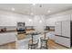 Stylish kitchen featuring white cabinets, granite countertops, and stainless steel appliances at 637 Marrian Dr, Clayton, NC 27520