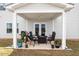 Cozy covered patio featuring outdoor seating and grill, perfect for entertaining at 637 Marrian Dr, Clayton, NC 27520