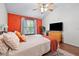 Bedroom with ample natural light, ceiling fan, and wood floors at 687 W Watson Rd, Benson, NC 27504