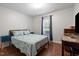 Bedroom boasts a window for natural light and hardwood floors throughout at 687 W Watson Rd, Benson, NC 27504