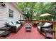 Large deck with outdoor seating, ideal for relaxation and entertaining with nature at 687 W Watson Rd, Benson, NC 27504