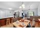 Inviting dining area open to the kitchen and living room with wood floors at 687 W Watson Rd, Benson, NC 27504