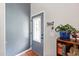 Neutral entryway featuring a decorative glass door, tile flooring, a bookshelf, and a 'Keys' hook at 687 W Watson Rd, Benson, NC 27504