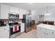 Kitchen featuring stainless steel appliances, granite countertops, and tiled backsplash at 687 W Watson Rd, Benson, NC 27504