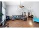 Spacious living room with hardwood floors, a vaulted ceiling, and large windows offering plenty of natural light at 687 W Watson Rd, Benson, NC 27504
