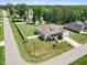 Aerial view of home showing well-manicured lawns and large backyard enclosed with white picket fence at 7801 Charters End St, Willow Springs, NC 27592