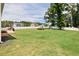 The large backyard features lush lawn space and a white privacy fence at 7801 Charters End St, Willow Springs, NC 27592