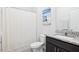 Bathroom showcases a shower with curtain, matching granite countertop and modern sink at 7801 Charters End St, Willow Springs, NC 27592
