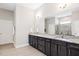 Bathroom with double vanity, granite counters, and tile floors and a glass enclosed shower at 7801 Charters End St, Willow Springs, NC 27592