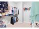 Walk-in closet with built in shelves and rods for organization and storage at 7801 Charters End St, Willow Springs, NC 27592
