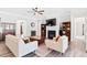 Inviting living room with hardwood floors, a fireplace, and neutral furniture for a relaxing and stylish space at 7801 Charters End St, Willow Springs, NC 27592