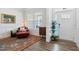 Inviting living room with hardwood floors, large windows, and elegant decor, offering a warm and welcoming atmosphere at 7801 Charters End St, Willow Springs, NC 27592