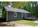 Spacious backyard with a deck, blue siding, perfect for outdoor entertaining and relaxation at 856 Williams White Rd, Zebulon, NC 27597