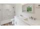 Beautiful bathroom featuring a double vanity, marble shower, and a modern design for ultimate comfort at 856 Williams White Rd, Zebulon, NC 27597