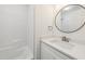 Bathroom features white vanity, sink, and a combined shower-tub at 856 Williams White Rd, Zebulon, NC 27597