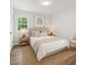 Cozy bedroom featuring a neutral palette, natural light, and decorative wall art at 856 Williams White Rd, Zebulon, NC 27597