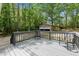 View of the deck and detached garage in wooded backyard at 856 Williams White Rd, Zebulon, NC 27597