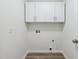 Laundry room area featuring white cabinets and utility hookups at 856 Williams White Rd, Zebulon, NC 27597