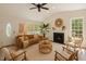Inviting living room with fireplace, ample natural light, and stylish decor at 856 Williams White Rd, Zebulon, NC 27597