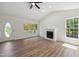 Spacious living room featuring a cozy fireplace and hardwood flooring at 856 Williams White Rd, Zebulon, NC 27597