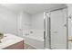Bathroom featuring a shower, soaking tub, and a vanity with sink at 8610 Neuse Landing Ln # 103, Raleigh, NC 27616