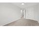 Standard bedroom featuring carpeted floors, neutral walls, and a ceiling fan at 8610 Neuse Landing Ln # 103, Raleigh, NC 27616