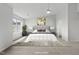 Primary bedroom with contemporary decor, carpet, and ample natural light at 8610 Neuse Landing Ln # 103, Raleigh, NC 27616