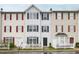 Traditional townhome featuring a white picket fence and well-maintained facade at 8610 Neuse Landing Ln # 103, Raleigh, NC 27616